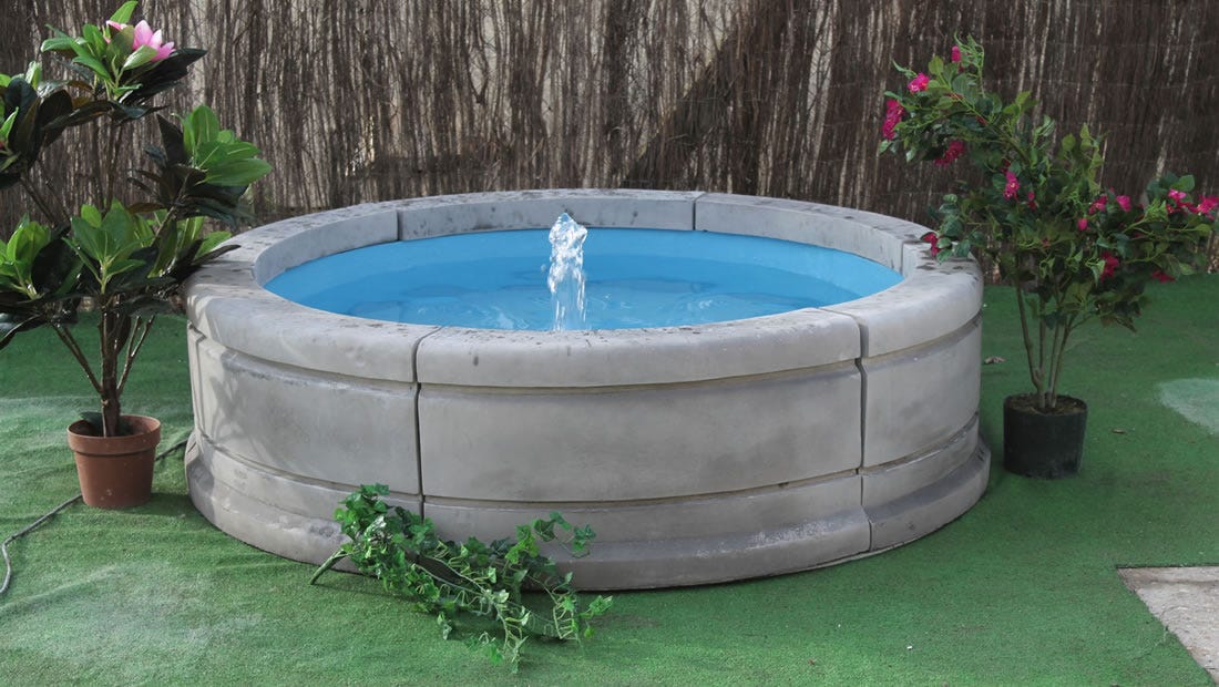 The Subtle Elegance of a Fountain Pool Surround in Garden Design